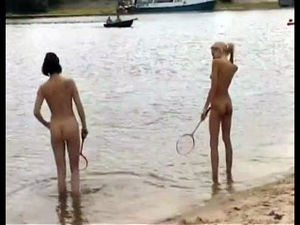 Slender naked teens playing badminton on